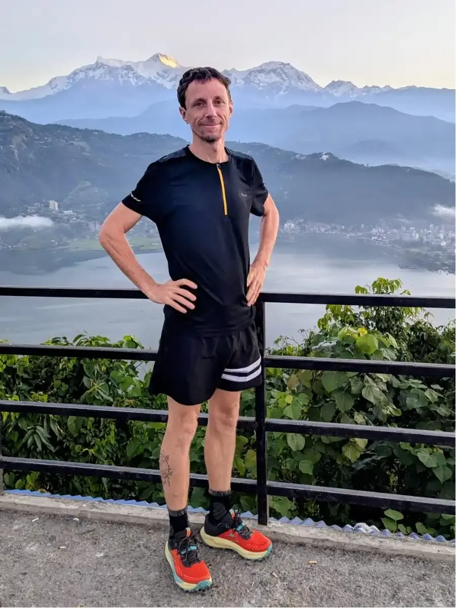 Gregory resting after Trail run Pokhara and mountain views in the backdrop